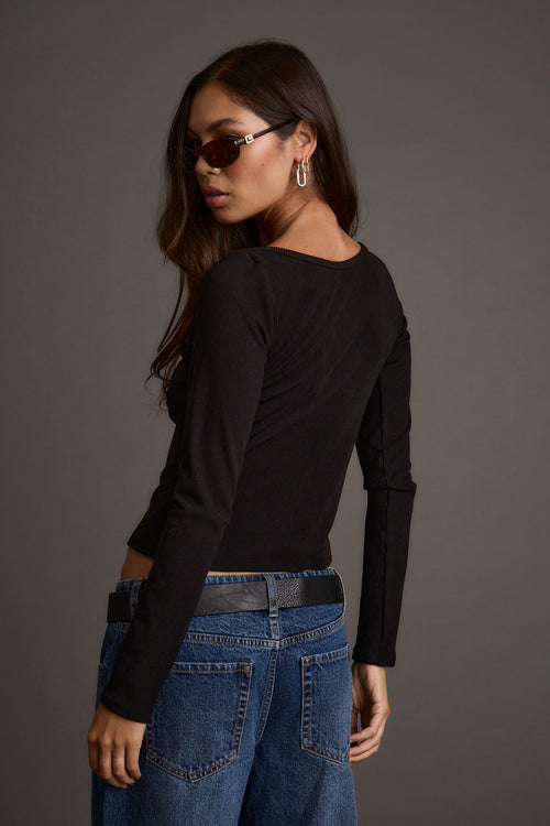 Back view of the black top showing the silhouette and fit.