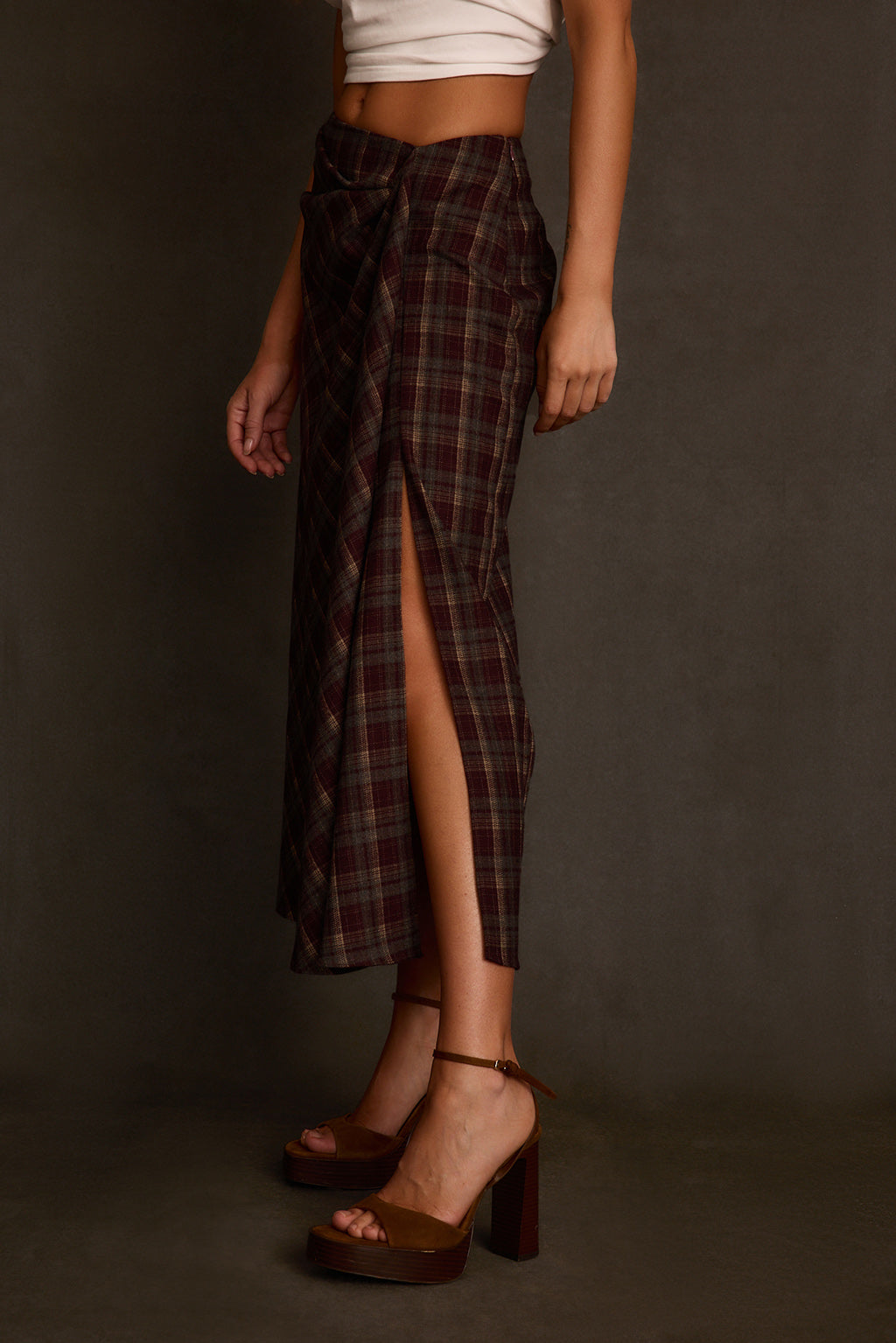 Women's skirt side angle showing bias plaid pattern and flowing maxi length