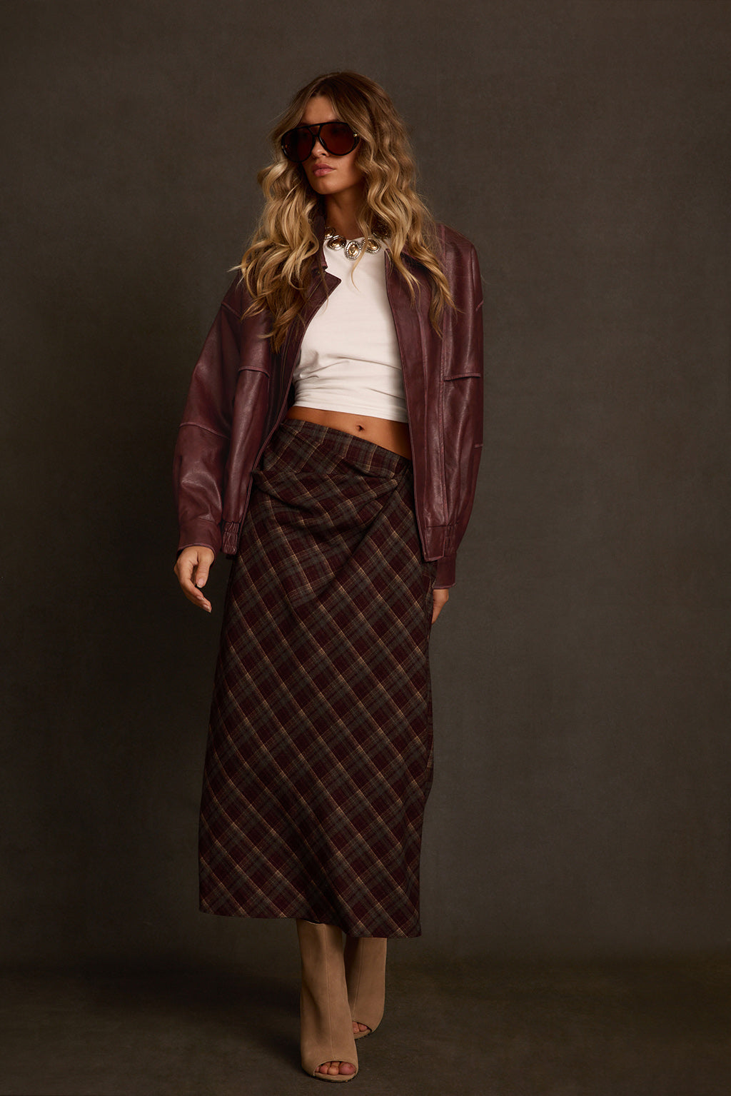 Fall skirt back view showing flat waistband and bias-cut plaid drape