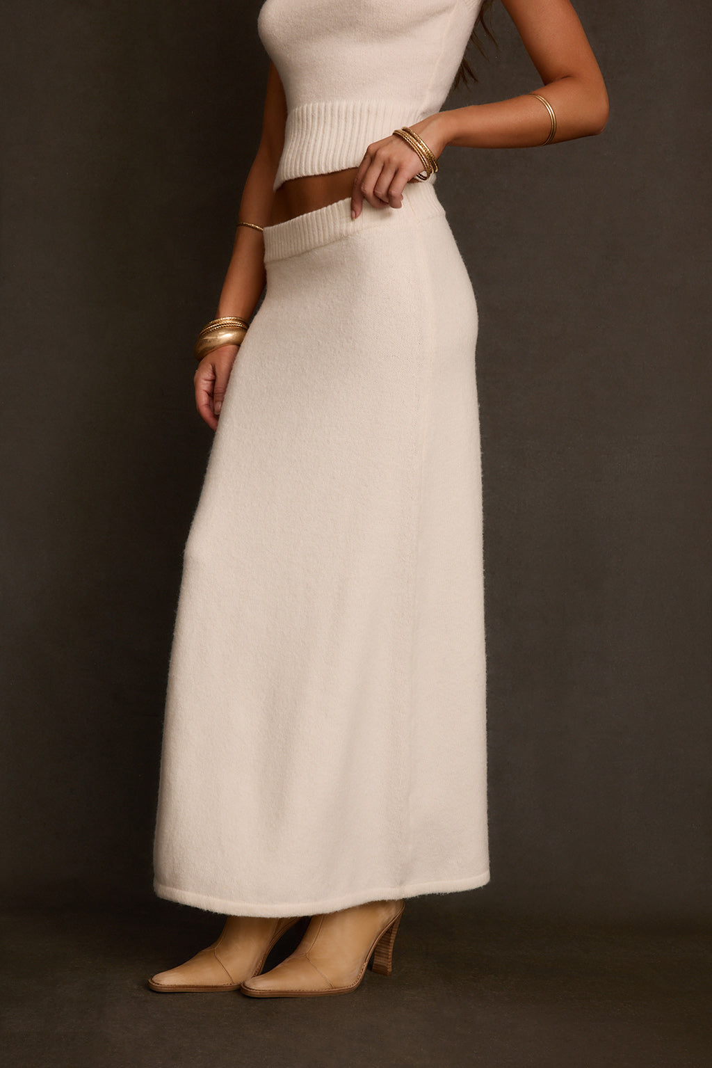 Ivory skirt back view with ribbed elastic waist and straight maxi silhouette