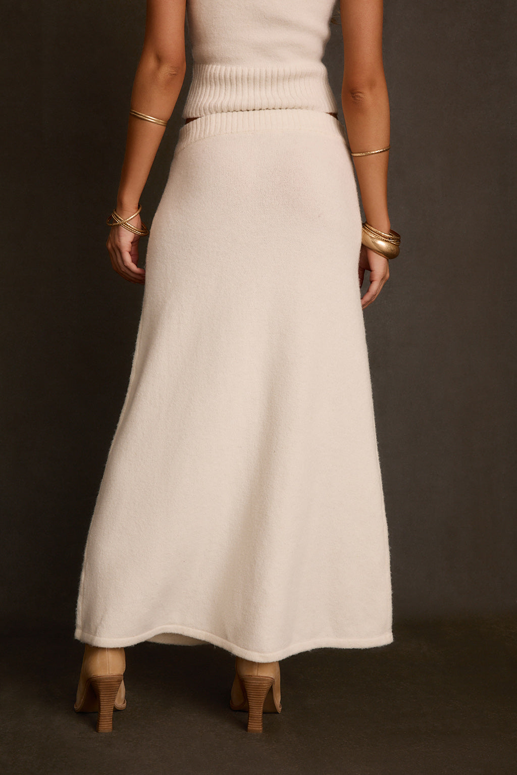 Fall skirt styled as matching set with Miel turtleneck, cognac belt, and gold bangles