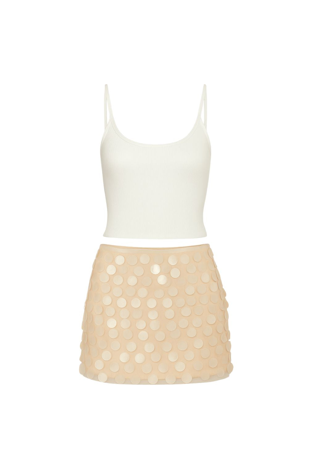 Lifestyle shot of the blush mini skirt styled for day-to-night versatility.
