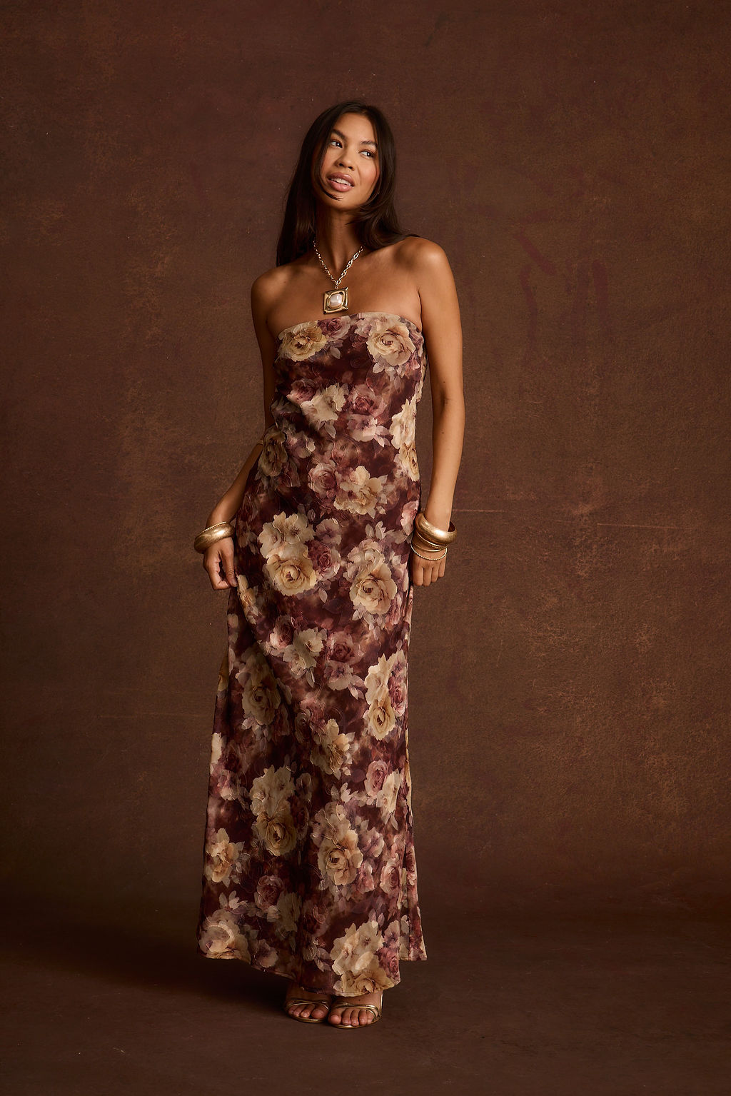 Front view of a strapless floral print maxi dress with a straight neckline.