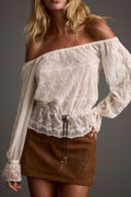 Ivory off-the-shoulder top with refined detailing and a flattering silhouette.