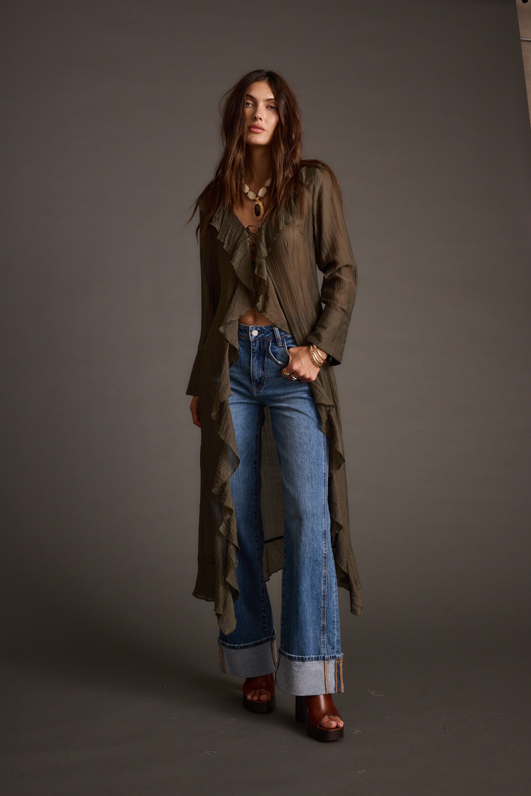Naomi Olive Longline Top paired with complementary accessories for a polished look.