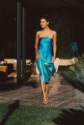 Blue strapless maxi dress with elegant accents, a blue ombre dress essential.