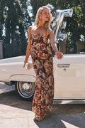 Strapless floral print maxi dress with a fitted bodice and floor-length skirt.