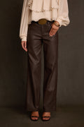 Coated pants in mocha styled with espresso surplice sweater and gold belt