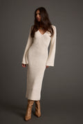 Cream sweater dress with elegant accents, a cream mini dress essential.
