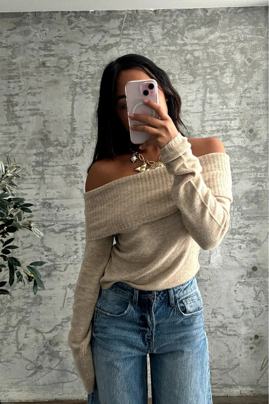 Close-up of the Nora Beige Off the Shoulder Sweater showcasing the fabric texture and design details.