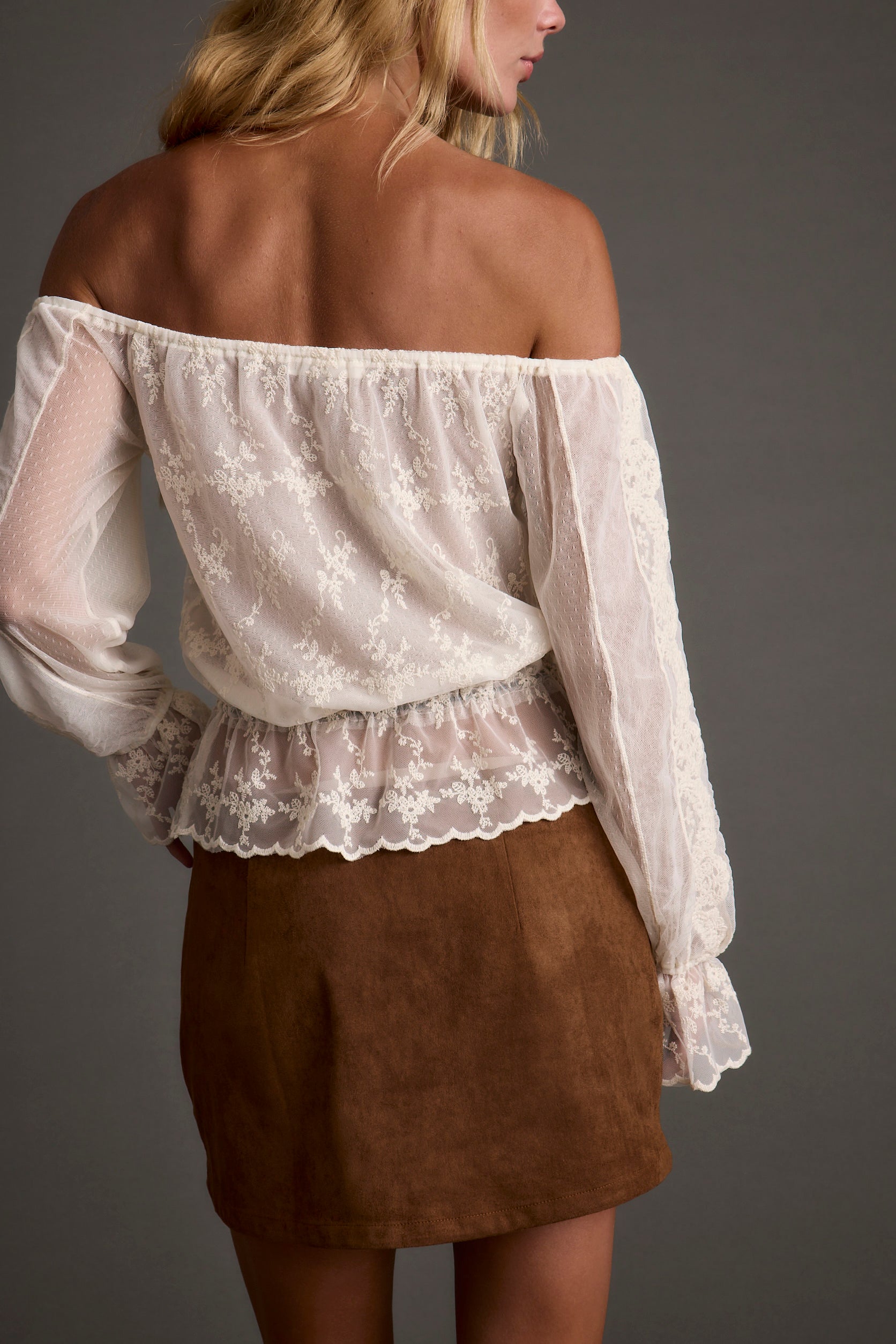 Norah Ivory Off Shoulder Top shown in a complementary styling arrangement.