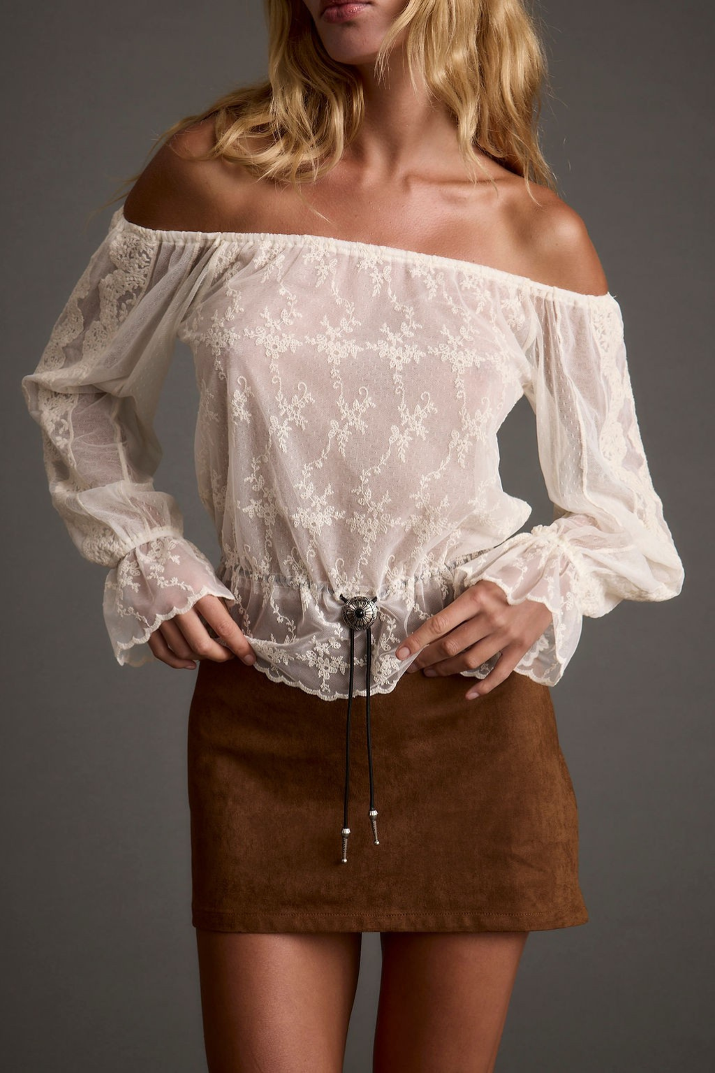 Detail shot of the Norah Ivory Off Shoulder Top highlighting the off-the-shoulder elements.