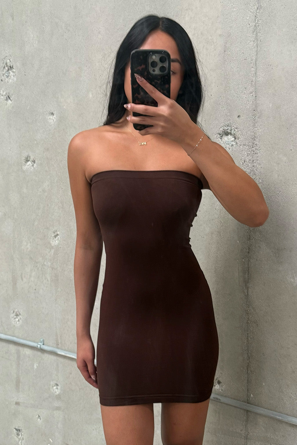 Close-up of the Norma Brown Strapless Under Dress showcasing the fabric texture and design details.