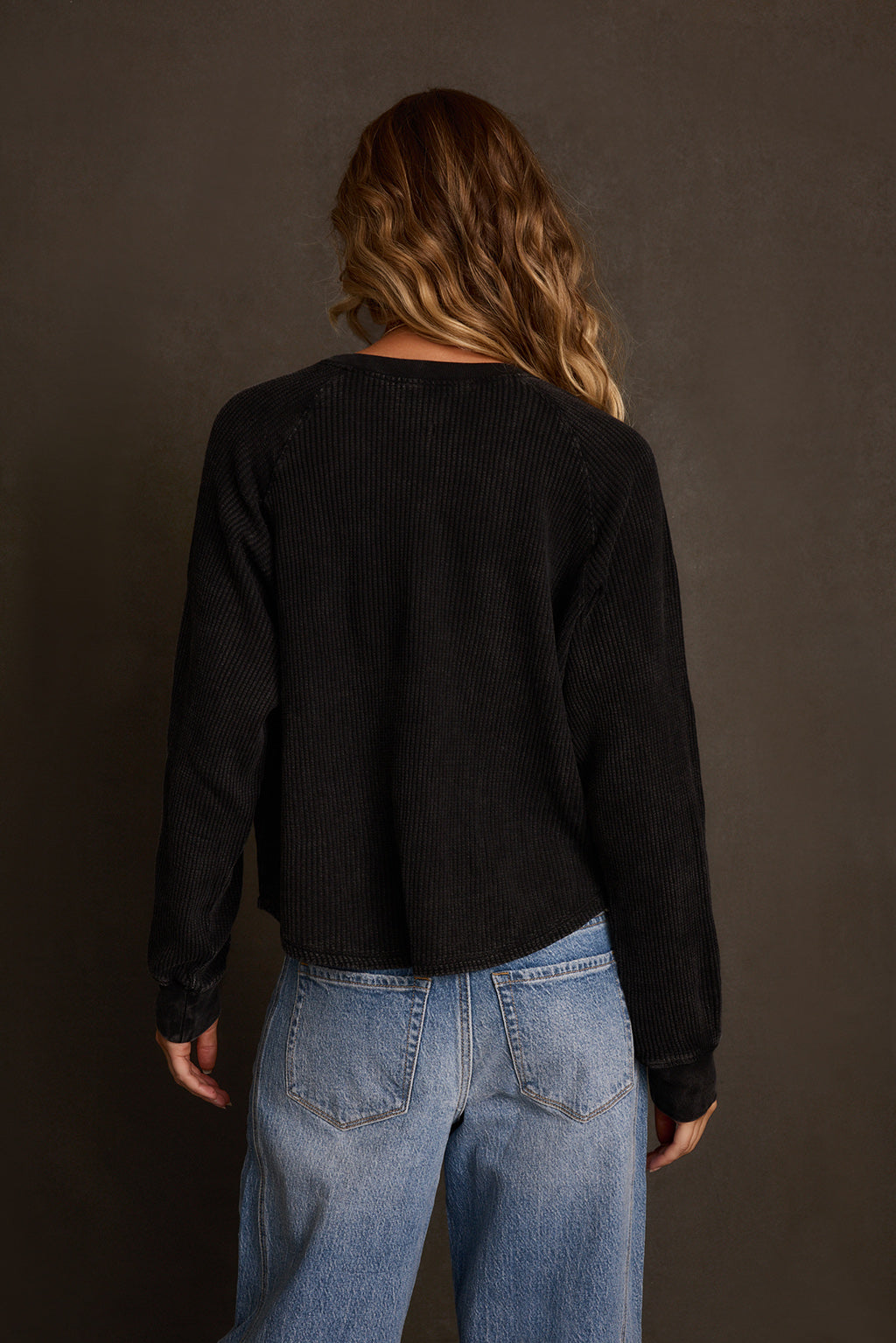 Fall top side angle showing cropped length and oversized relaxed silhouette