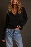 Waffle knit henley in washed black with button placket, styled with barrel jeans and gold pendant