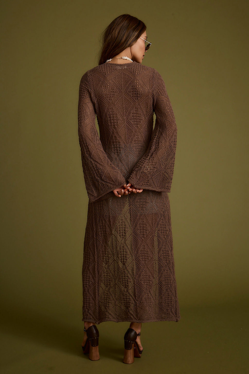 Back view of the mocha knit cardigan showing the silhouette and fit.