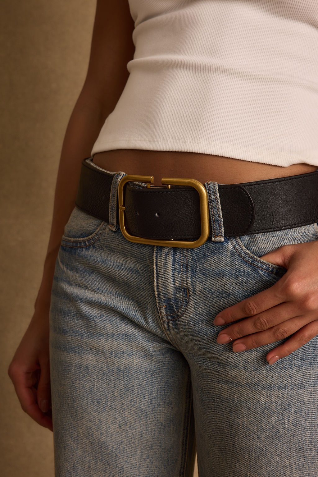 Close-up of the Oro Black and Gold Belt showcasing the fabric texture and design details.