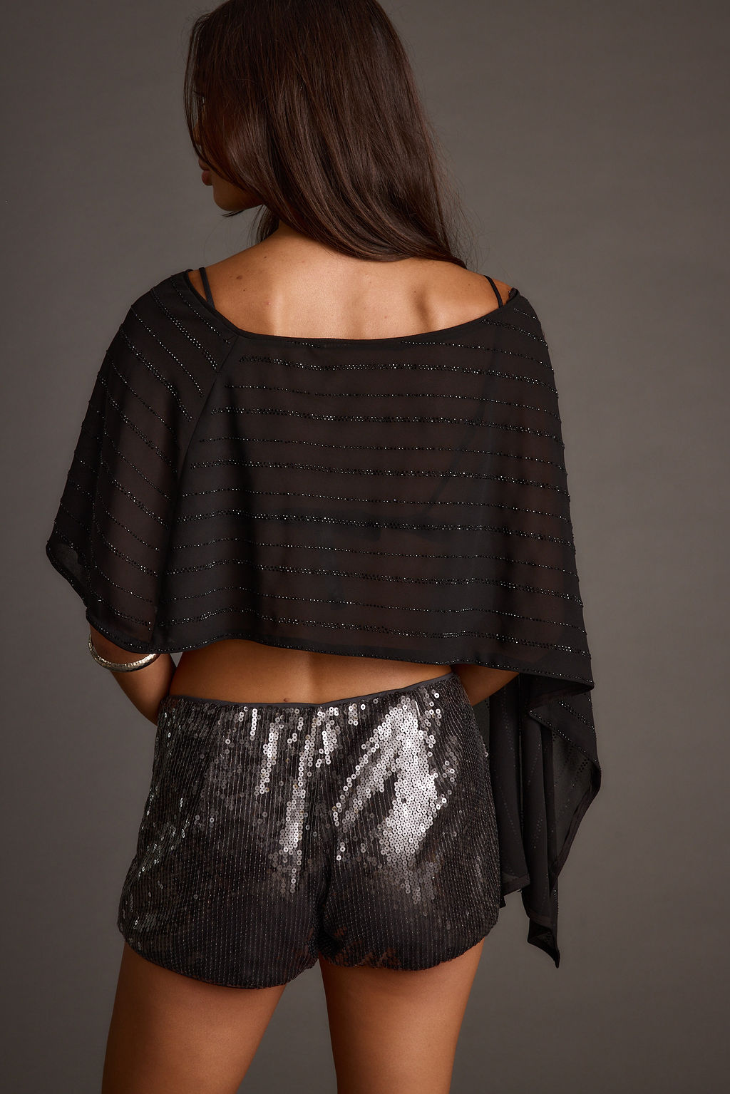 Lifestyle shot of the black piece styled for day-to-night versatility.