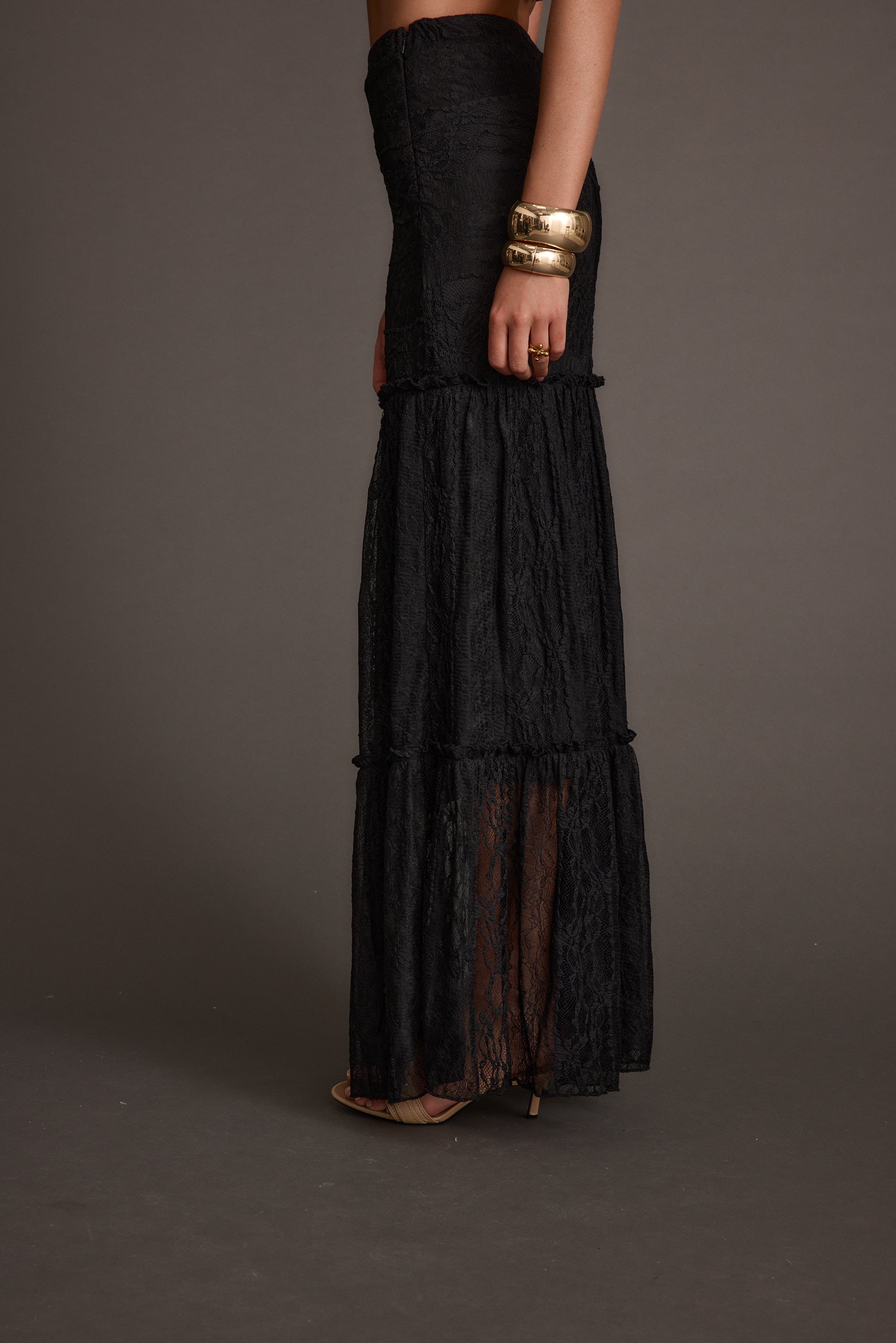 Poppy Black Lace Maxi Skirt paired with complementary accessories for a polished look.
