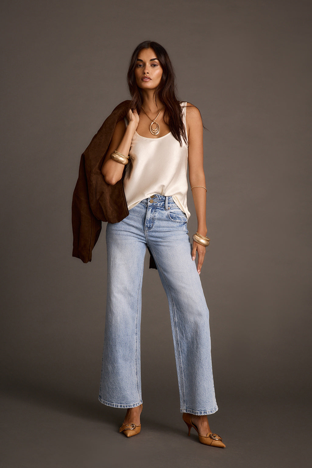 Women's ivory satin tank top and wide-leg jeans, full-length front view