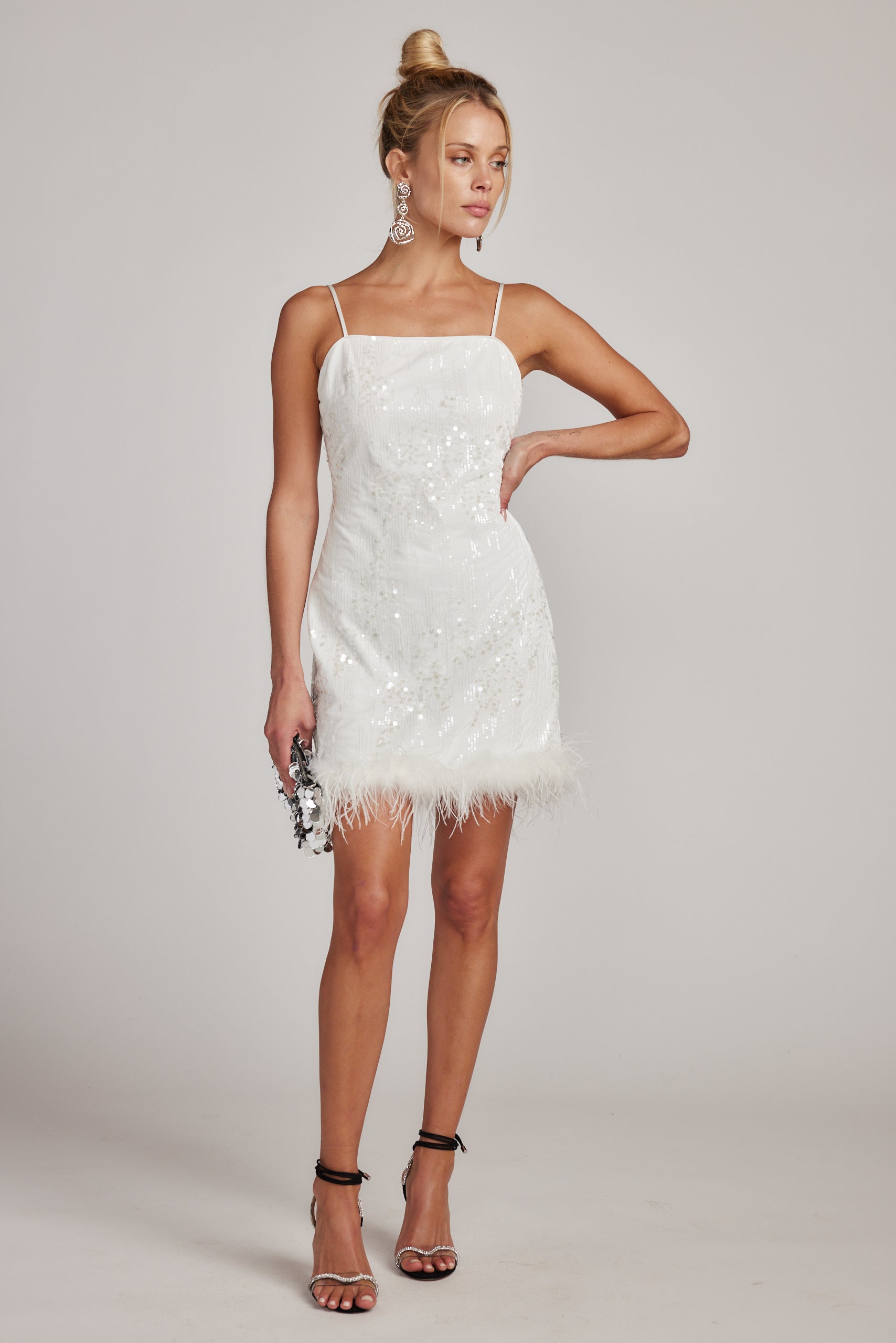 Priscilla Sequin Mini Dress with Feather Trim shown in a complementary styling arrangement.