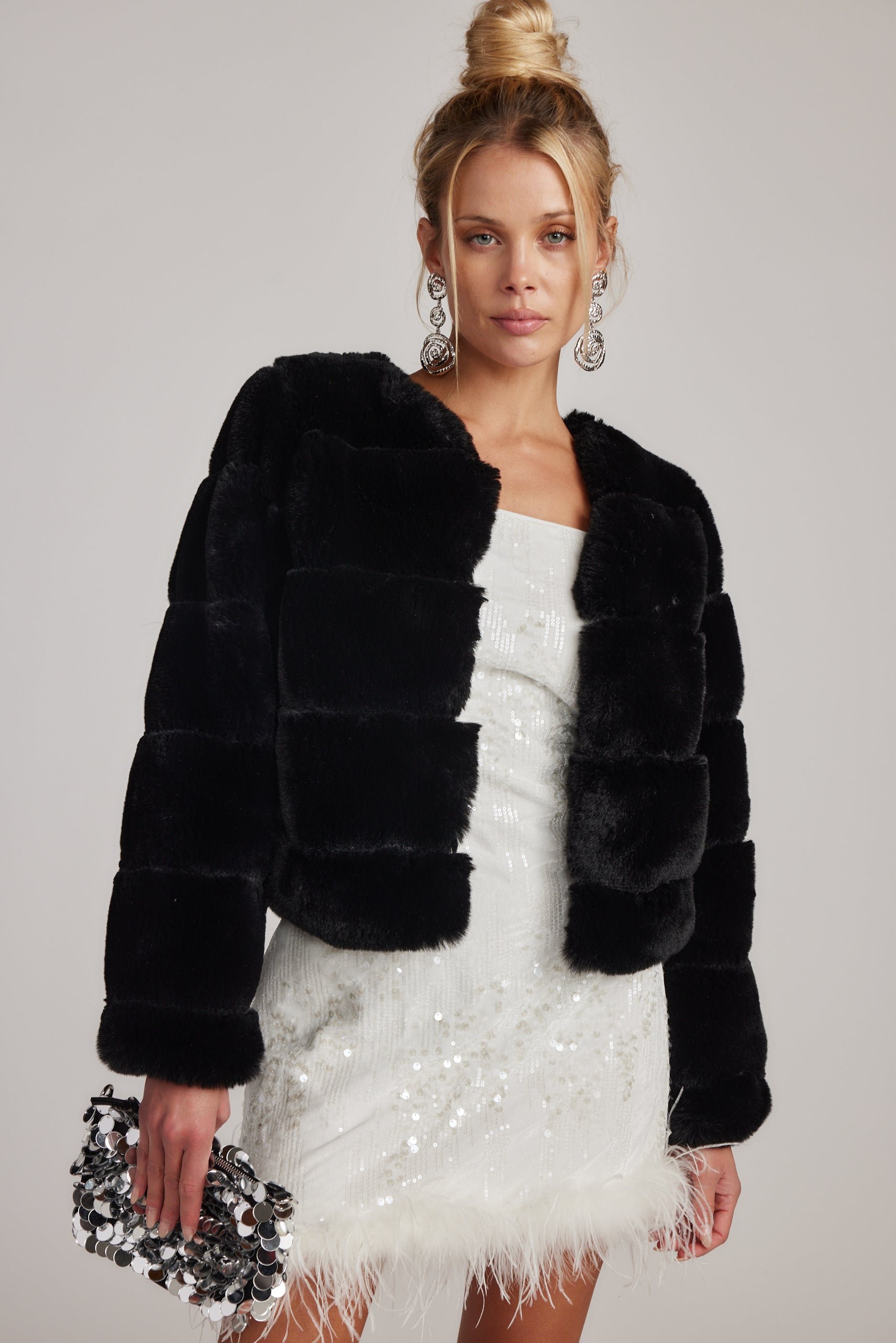 Detail shot of the Priscilla Sequin Mini Dress with Feather Trim highlighting the sequin and feather elements.