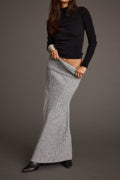 Sweater with elegant accents, a lace maxi skirt essential.