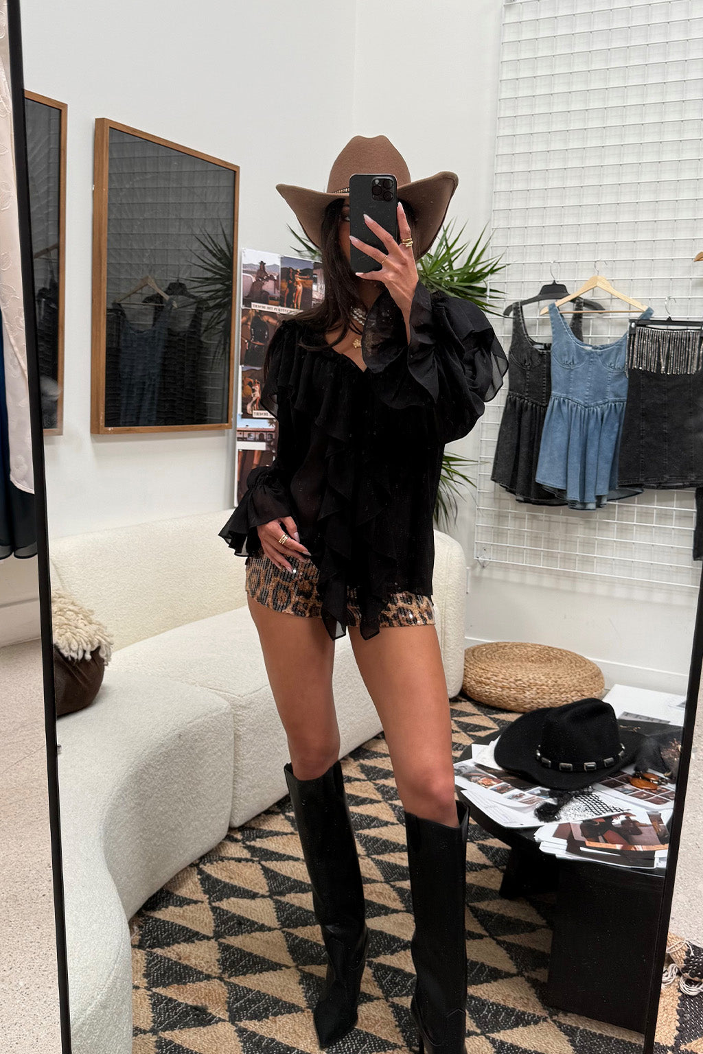 Detail shot of the Harlow Black Ruffle Blouse highlighting the ruffled elements.