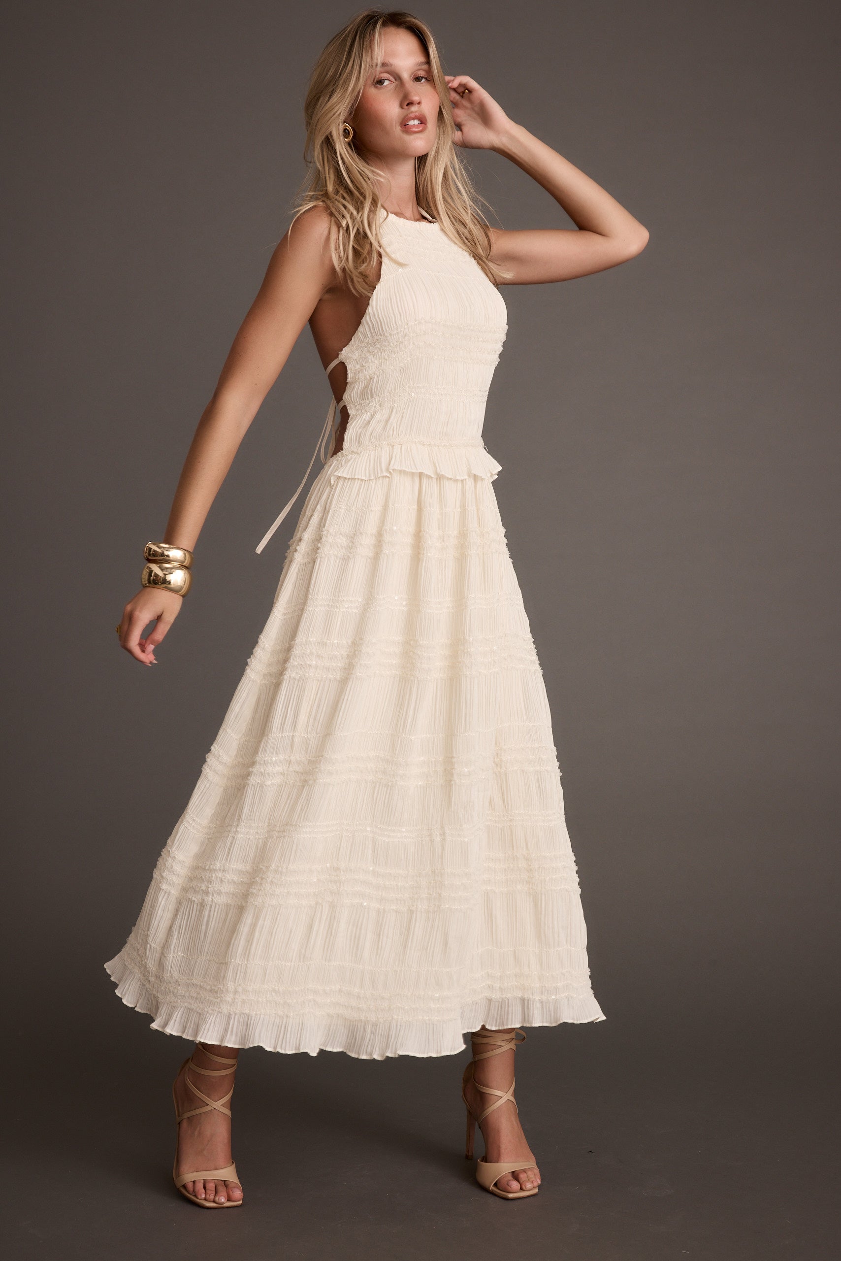Detail shot of the Quinn Ivory High Neck Shimmer Chiffon Maxi Dress highlighting the high-neck elements.