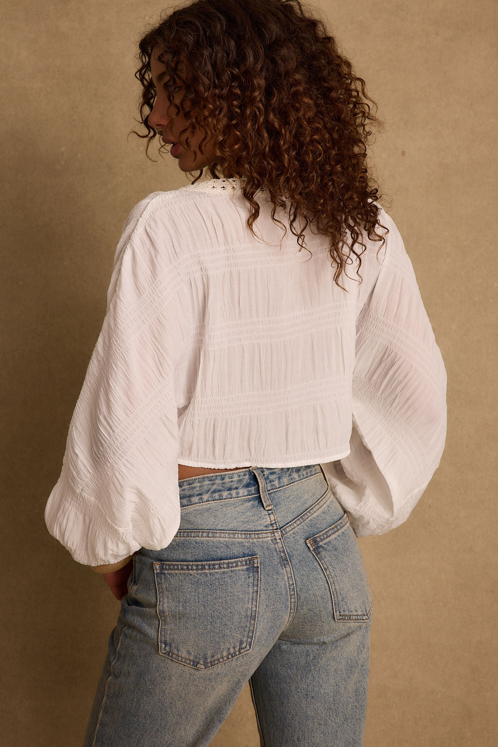 Additional view of the Rainey White Lace Up Top from a different perspective.