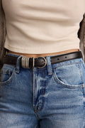 Black leather belt with refined detailing and a flattering silhouette.