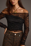 Black lace top with refined accents, a black lace skirt essential.