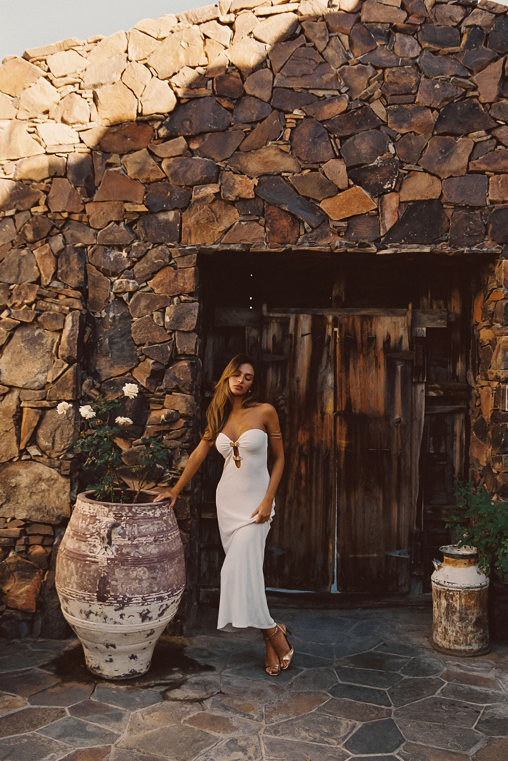 Rayne White Embellished Maxi Dress paired with complementary accessories for a polished look.