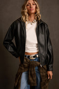 Vegan leather jacket in black with zip front, oversized fit, styled with white tee and plaid flannel