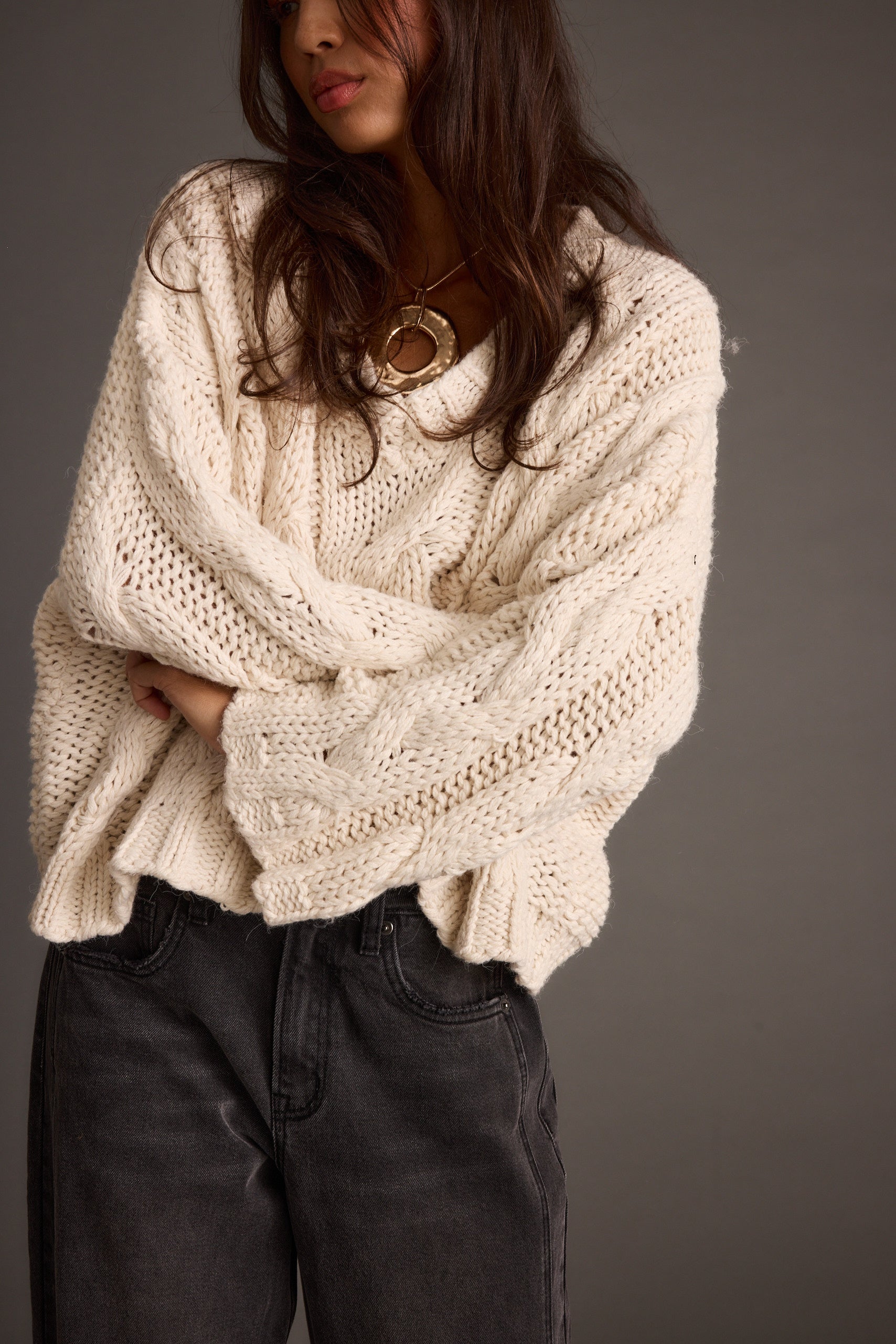 Detail shot of the Remi Ivory Cable Knit Sweater highlighting the knit elements.