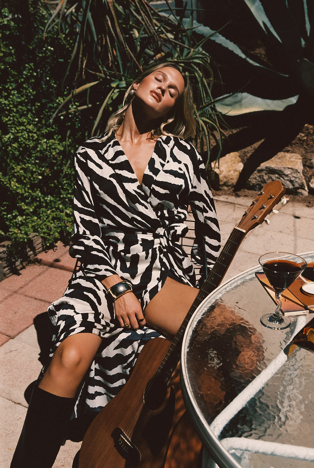 Close-up of the Renna Zebra Long Sleeve Wrap Midi Dress showcasing the fabric texture and design details.