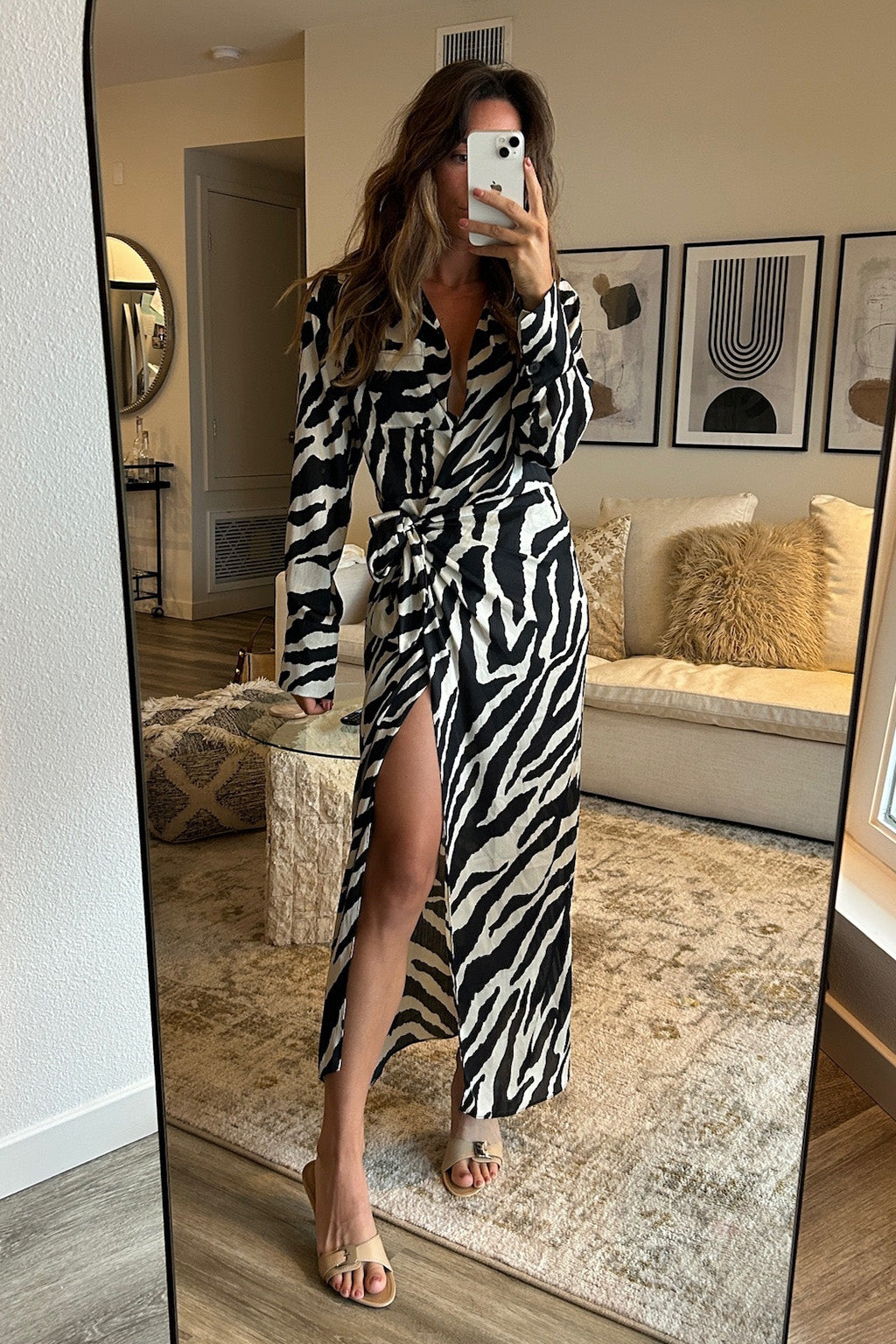 Zebra print wrap midi dress with elegant accents, a zebra print dress essential.