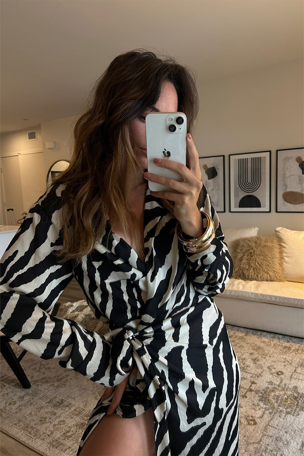 Back view of the zebra print midi dress showing the silhouette and fit.