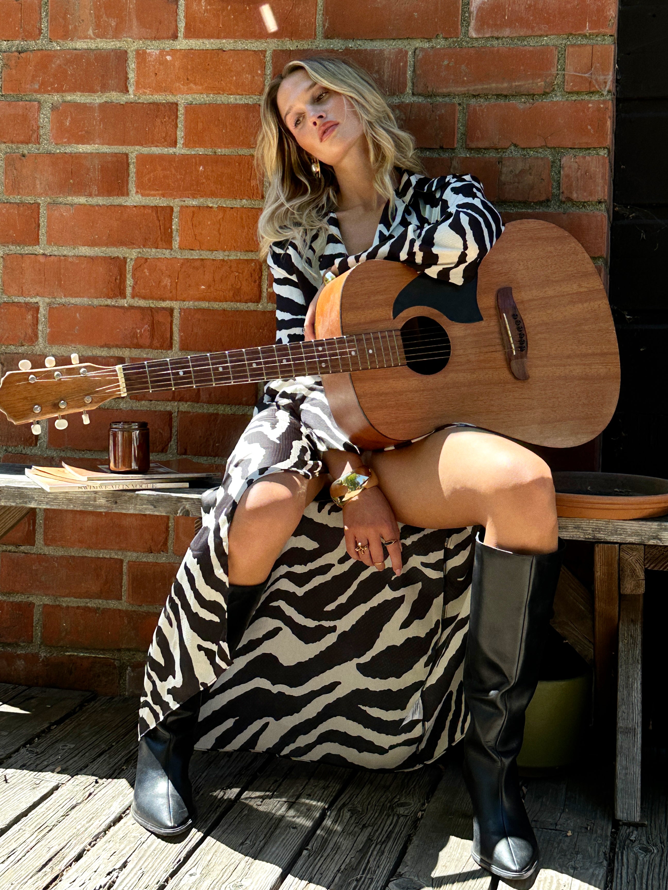 Detail shot of the Renna Zebra Long Sleeve Wrap Midi Dress highlighting the wrap elements.