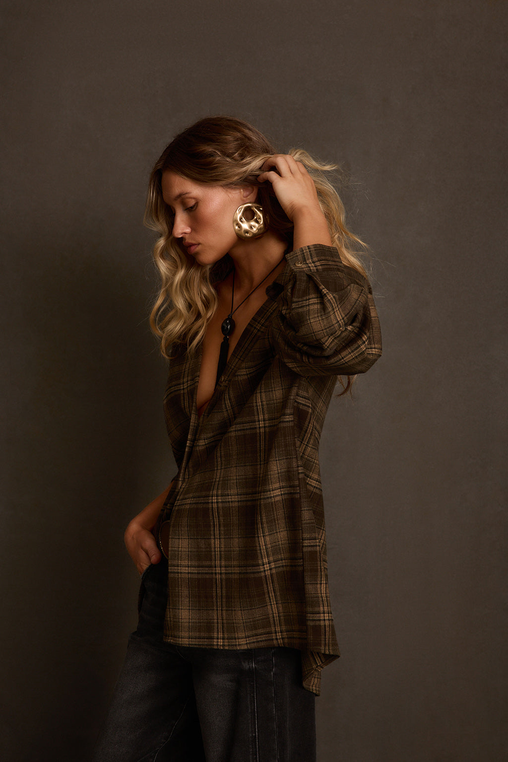 Fall flannel back view on model showing boxy oversized silhouette and plaid pattern