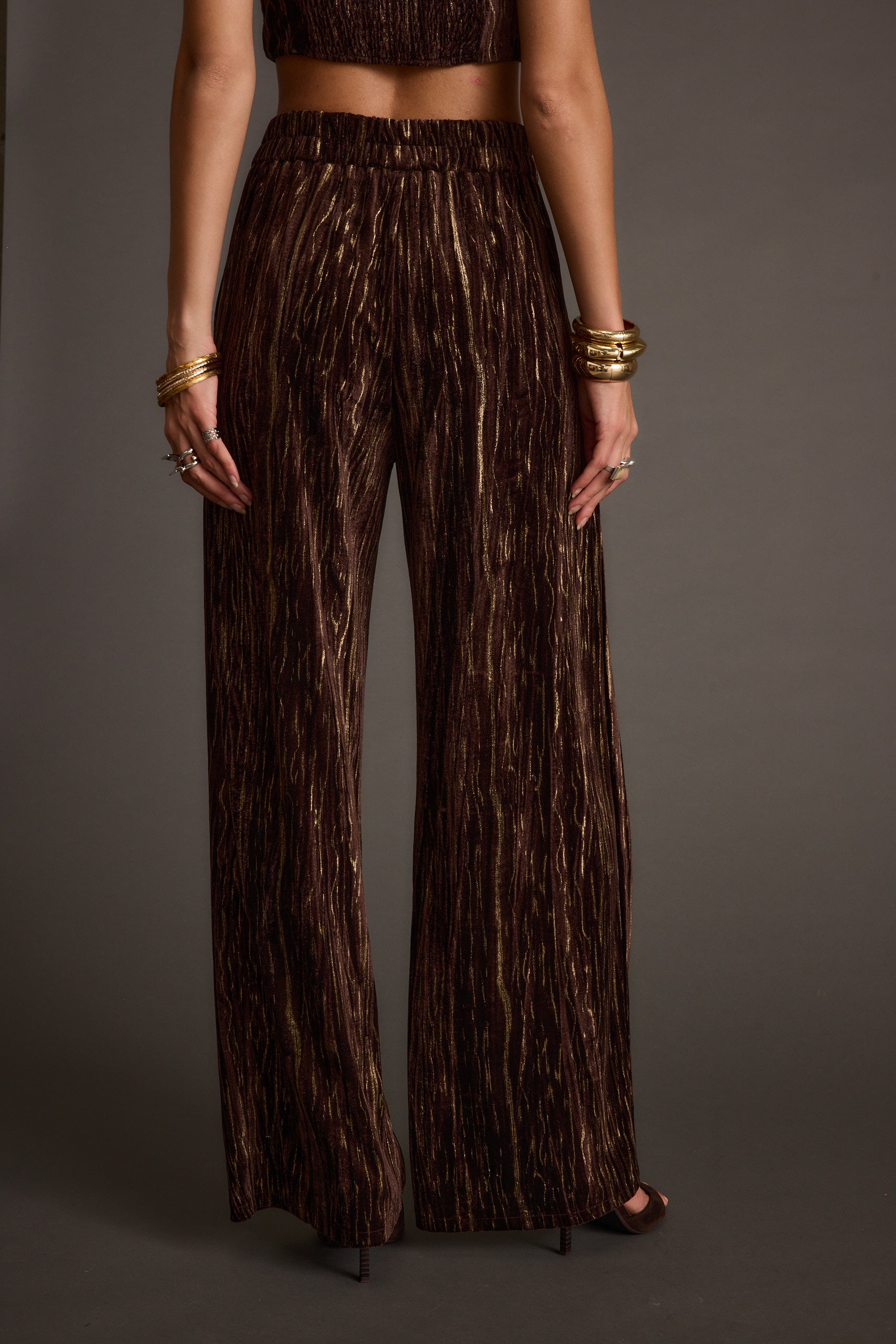 Rhea Espresso Velvet Trousers paired with complementary accessories for a polished look.