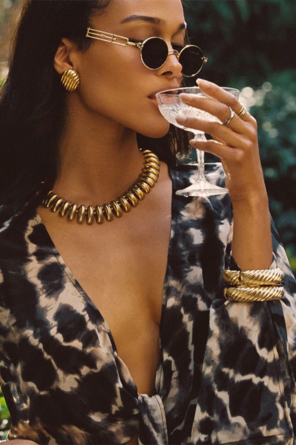 Rosario Tie Dye Wrap Top paired with complementary accessories for a polished look.