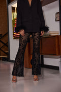 Black velvet flared flare pants with refined accents, a black lace pants standout.
