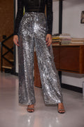 Silver sequin trousers with refined accents, a silver sequin pants standout.