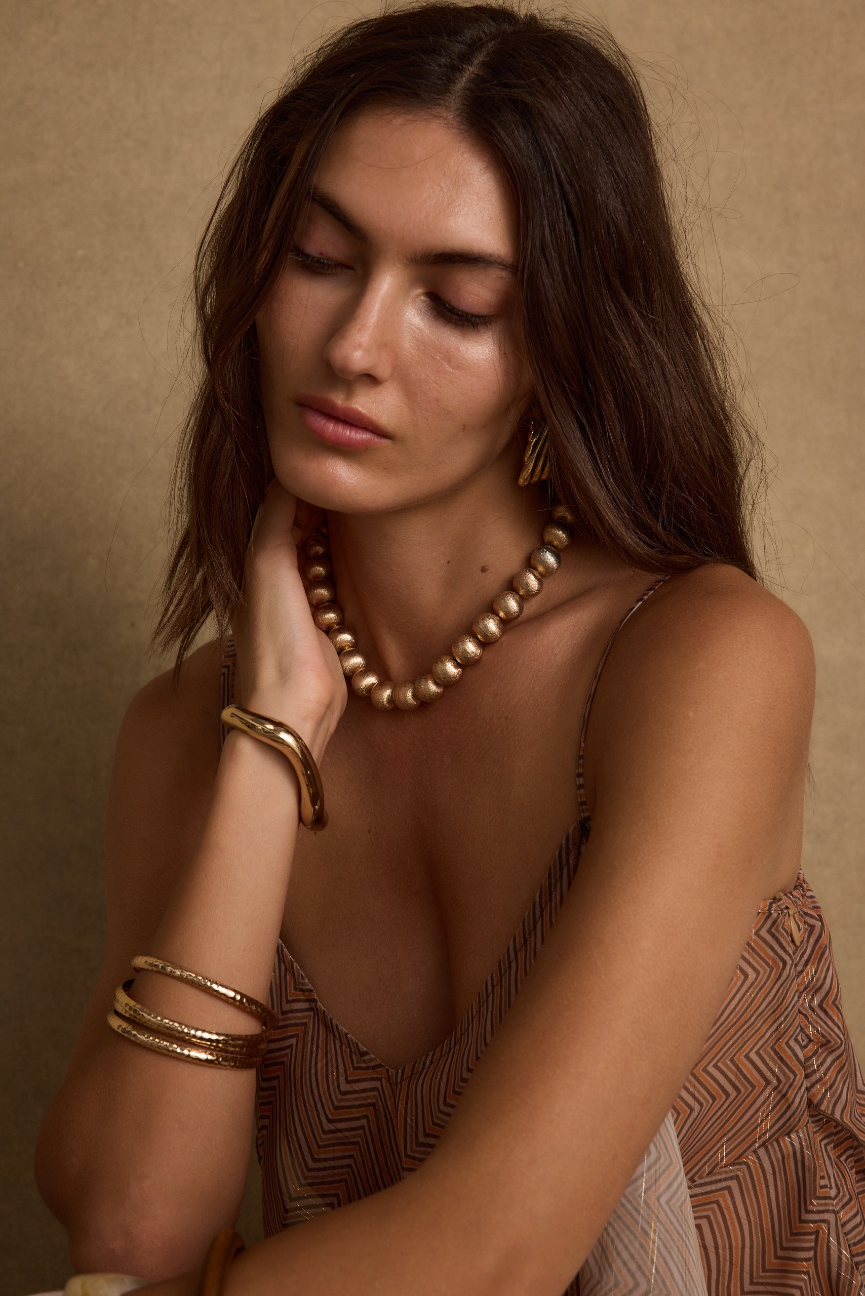Detail shot of the Solstice Gold Beaded Necklace highlighting the beaded elements.