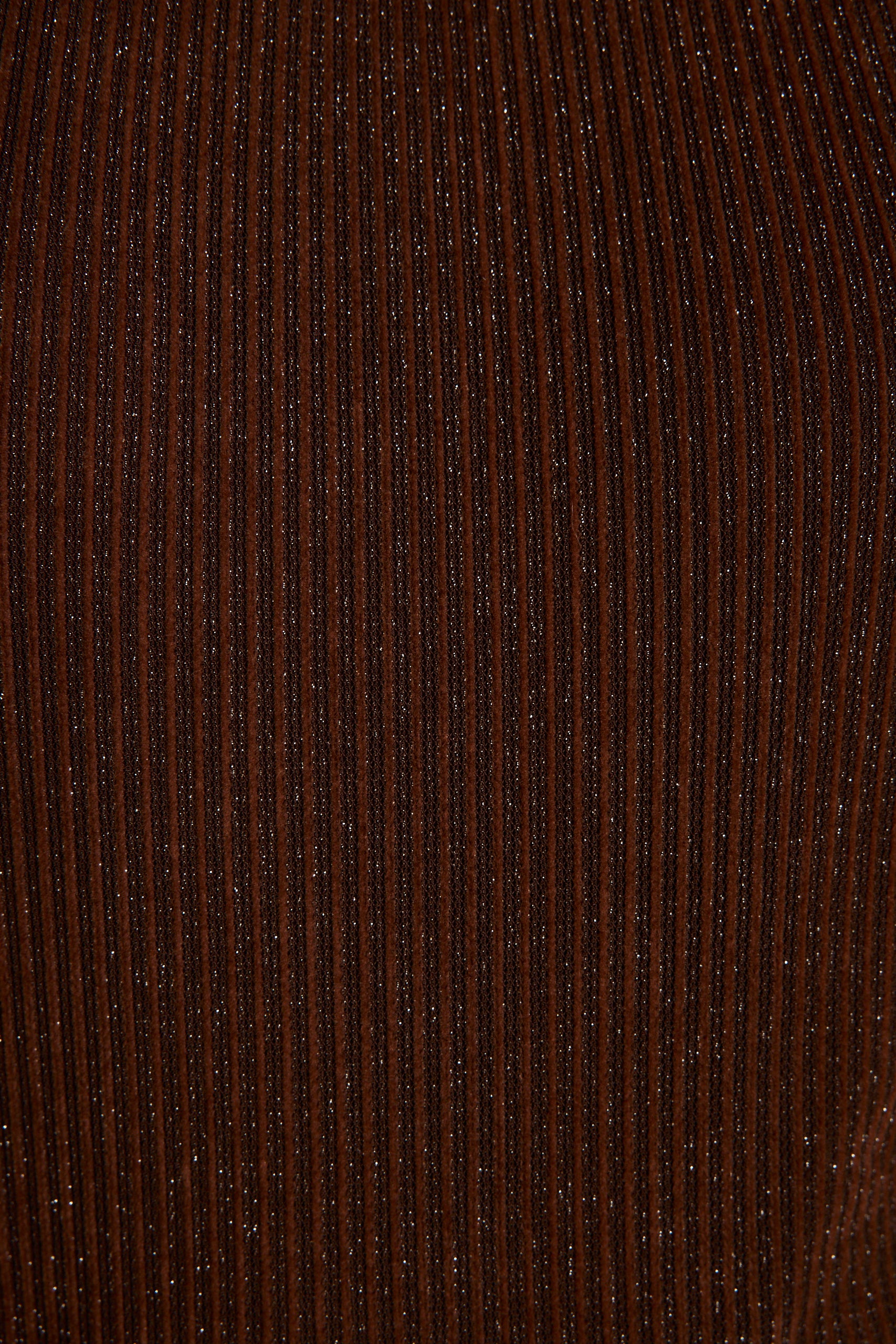 Detail shot of the Stellan Espresso Halter Jumpsuit highlighting the halter elements.