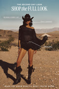 Woman in desert wearing McGraw cowboy hat, black Indie cape dress, Calico belt, Bailey earrings, and studded boots for "The Second Day Look" outfit guide.