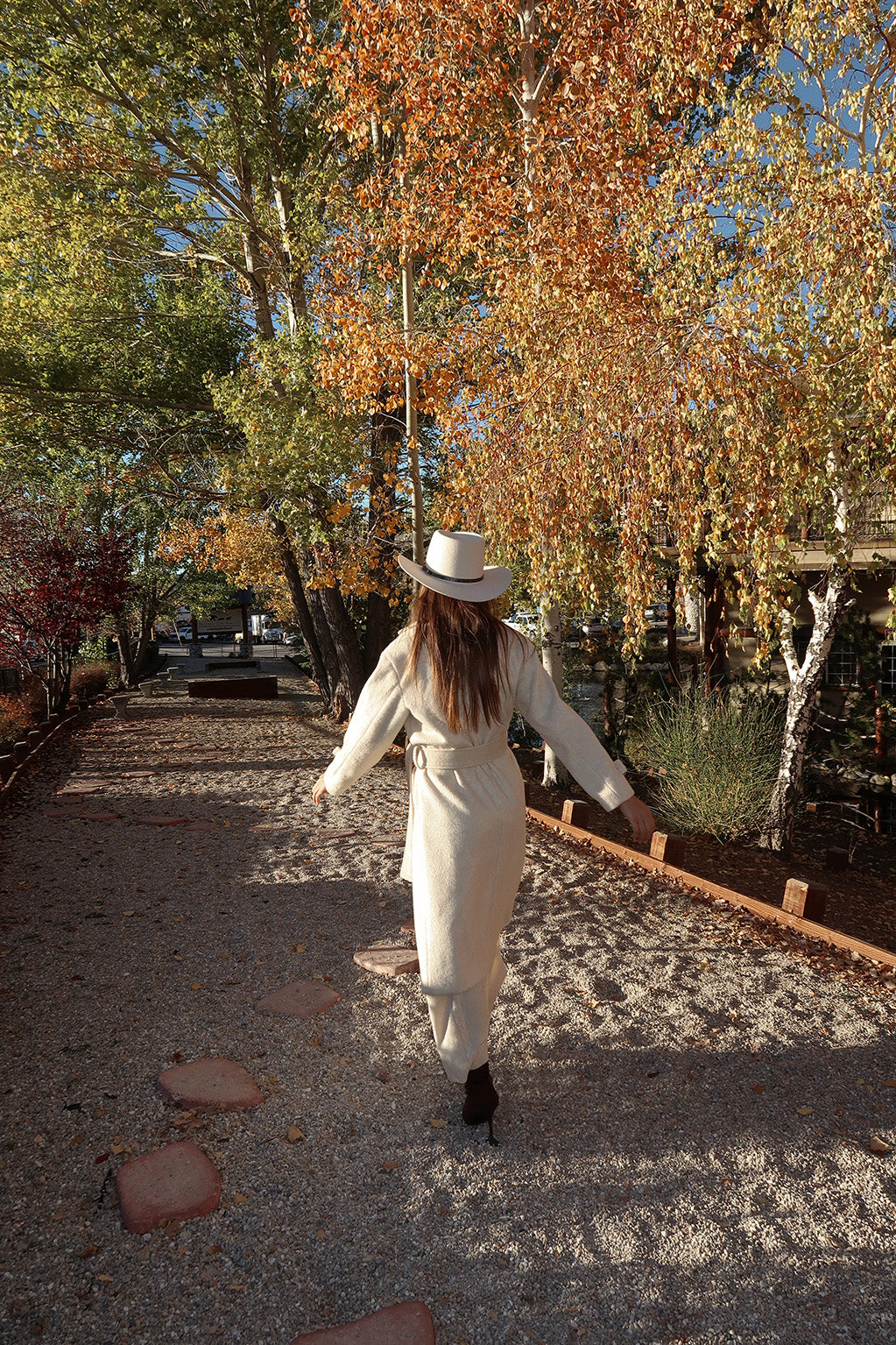 Sinclair Ivory Belted Coat paired with complementary accessories for a polished look.