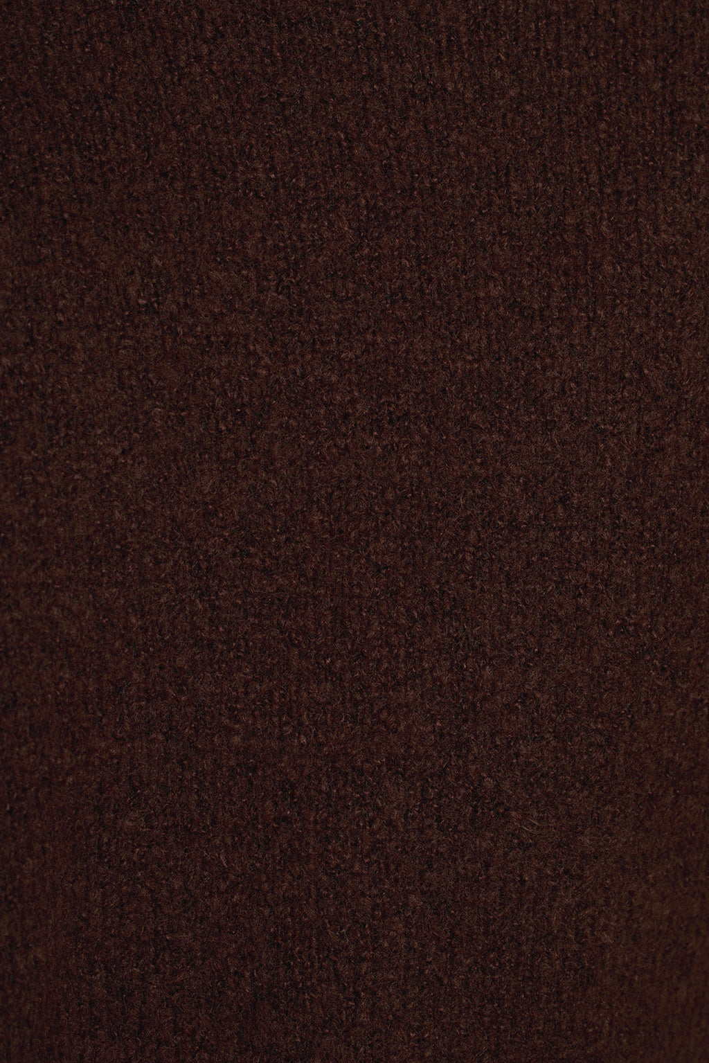 Cinnamon sweater fabric close-up showing soft knit texture and surplice overlap detail
