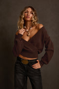 Women's sweater in cinnamon with surplice wrap neckline, styled with denim and oval gold belt
